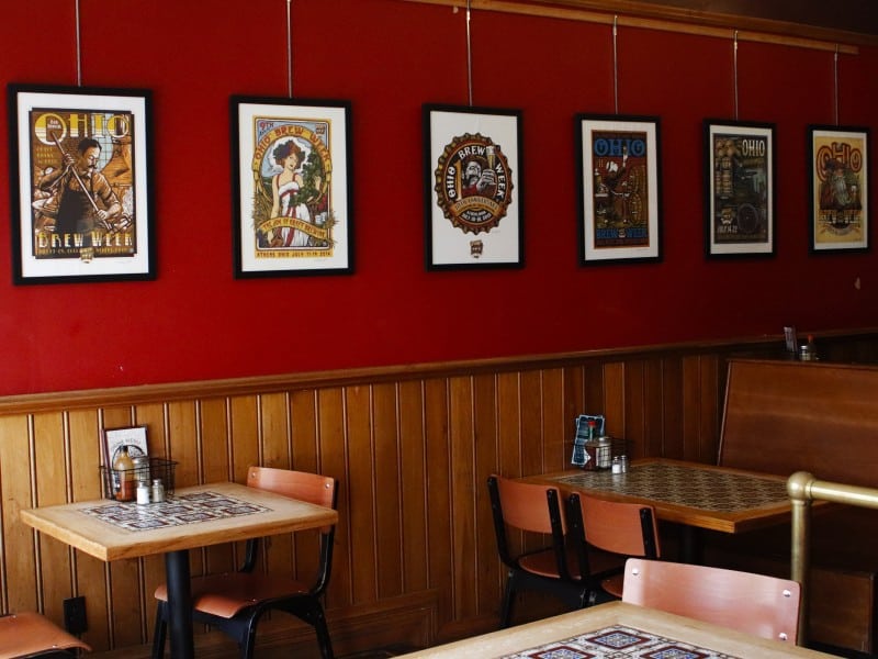 Posters by Kevin Morgan created for Ohio Brew Week, displayed at Casa Nueva and Catina in Athens, Ohio, in July 2025.