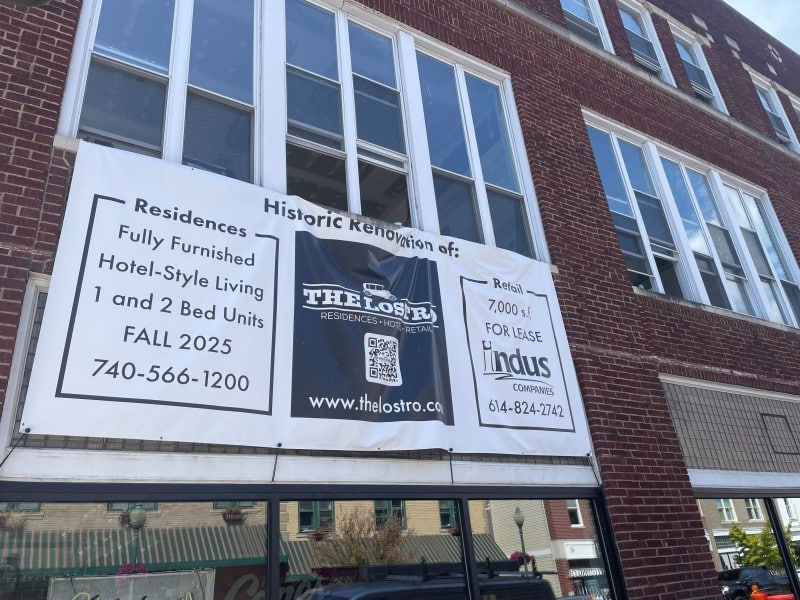 Banner hanging at the Lostro Project property in Uptown Athens.