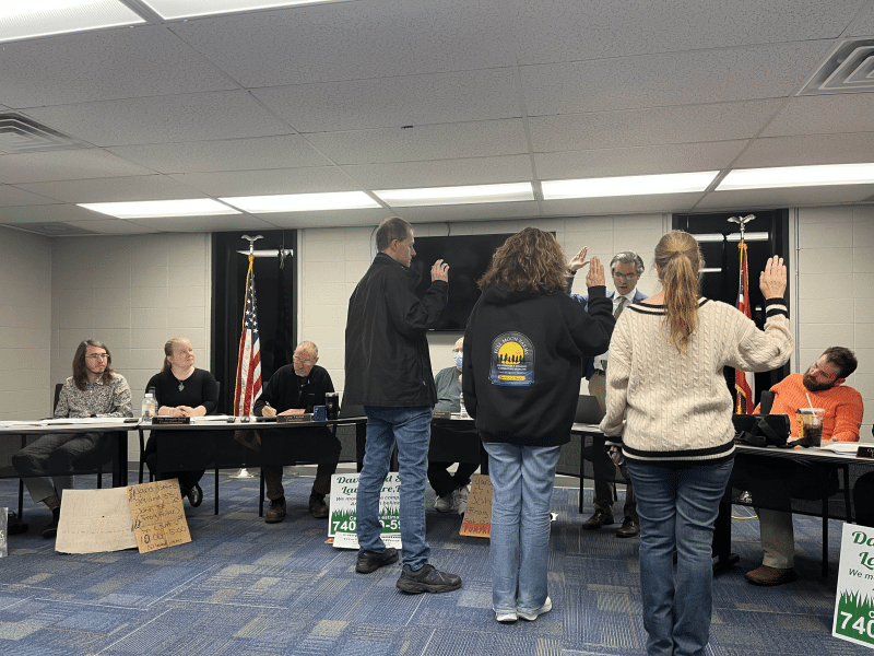 Group of people getting sworn in