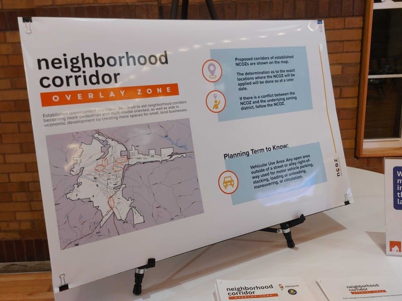 A photo of a poster board at a public meeting.