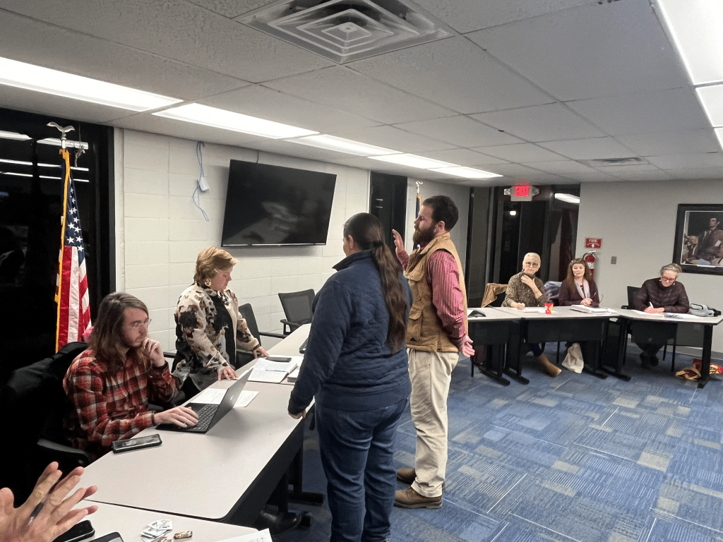 Charlotte Beach and Cameron Peck are sworn into council during the charter council's Tuesday, Jan. 6